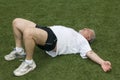 Middle age man stretching sports field Royalty Free Stock Photo