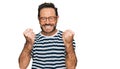 Middle age man wearing casual clothes and glasses excited for success with arms raised and eyes closed celebrating victory smiling Royalty Free Stock Photo