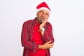 Middle age man wearing Christmas Santa hat standing over isolated white background thinking looking tired and bored with Royalty Free Stock Photo