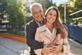 Middle age man and woman couple hugging each other standing at park Royalty Free Stock Photo