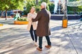 Middle age man and woman couple smiling confident dancing at park Royalty Free Stock Photo