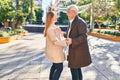 Middle age man and woman couple smiling confident dancing at park Royalty Free Stock Photo