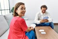 Middle age man and woman couple smiling confident playing poker cards at home Royalty Free Stock Photo