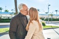 Middle age man and woman couple standing together kissing at park Royalty Free Stock Photo