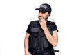 Middle age policeman wearing police uniform and bulletproof vest over white background thinking concentrated about doubt with