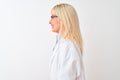 Middle age scientist woman wearing glasses standing over isolated white background looking to side, relax profile pose with Royalty Free Stock Photo