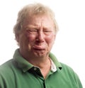 Middle age senior man emotional face crying upset