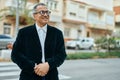 Middle age southeast asian man standing and smiling confident at the city Royalty Free Stock Photo