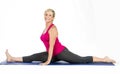 Middle age woman doing split exercises