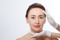 Middle age woman getting spa treatment. Face massage. Anti aging botox and collagen. Plastic surgery concept with doctor hands iso