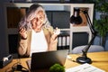 Middle age woman with grey hair working using computer laptop late at night celebrating surprised and amazed for success with arms Royalty Free Stock Photo