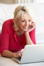Middle age woman on her laptop computer Royalty Free Stock Photo