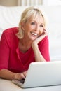 Middle age woman on her laptop computer Royalty Free Stock Photo