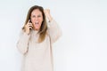 Middle age woman talking on smartphone over isolated background annoyed and frustrated shouting with anger, crazy and yelling with Royalty Free Stock Photo