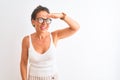 Middle age woman wearing casual t-shirt and glasses standing over isolated white background very happy and smiling looking far Royalty Free Stock Photo