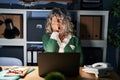 Middle age woman working at night using computer laptop yawning tired covering half face, eye and mouth with hand Royalty Free Stock Photo