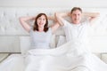 Middle age woman and man in bed. Senior couple dreaming and thinking in bedroom. Template and blank t shirt. Copy space. Mock up