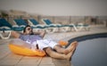 Middle aged arab man by a pool