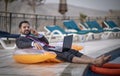 Middle aged arab man by a pool in his business suit Royalty Free Stock Photo