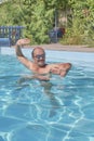 A man swims in a pool in the courtyard Royalty Free Stock Photo
