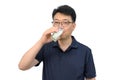 A middle-aged Asian man is drinking a fresh glass of milk on white background Royalty Free Stock Photo