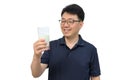 A middle-aged Asian man is drinking a fresh glass of milk on white background Royalty Free Stock Photo