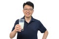 A middle-aged Asian man is drinking a fresh glass of milk on white background Royalty Free Stock Photo