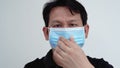 A middle-aged Asian man wearing a mask to prevent the cobid-19 epidemic.