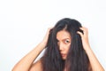 Middle aged Asian woman looking at camera worried about damaged hair. Healthy and beauty Royalty Free Stock Photo