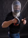 Middle aged bearded man with epee and helmet