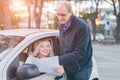 Middle-aged beautiful woman asking the way from passerby Royalty Free Stock Photo