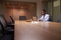 Middle aged black businessman working late alone in office Royalty Free Stock Photo