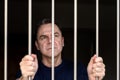 Middle aged blue eyed man incarcerated Royalty Free Stock Photo