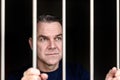 Middle aged blue eyed man incarcerated Royalty Free Stock Photo