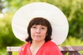 A middle-aged brunette white hat Royalty Free Stock Photo