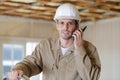 middle-aged builder talking into walkie talkie Royalty Free Stock Photo