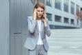 Middle aged business woman, patient has severe headache, businesswoman trying to call doctor using phone Royalty Free Stock Photo