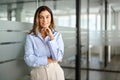 Middle aged business woman standing in office looking at camera, portrait. Royalty Free Stock Photo