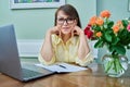 Middle aged business woman working from home at desk using laptop Royalty Free Stock Photo