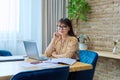 Middle aged business woman working in office using paper laptop Royalty Free Stock Photo
