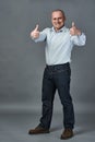 Mature businessman showing thumbs up sign Royalty Free Stock Photo