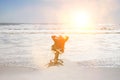 Middle aged businessman relaxing on office chair at beach Royalty Free Stock Photo