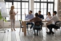 Middle-aged businesswoman talk make whitebeard presentation at meeting Royalty Free Stock Photo