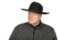 Middle Aged Caucasian Man in Black Cowboy Hat Staring Intensely - Photo Isolated on White Background