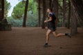 Middle aged caucasian man trail running outdoor