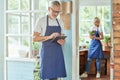 Middle aged caucasian man working in garden house Royalty Free Stock Photo