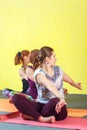 Middle aged caucasian women practicing yoga