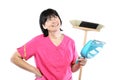 Middle aged cleaning lady with broom and scoop