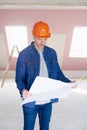 Construction worker studying blueprint Royalty Free Stock Photo