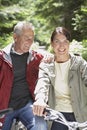 Middle Aged Couple With Bikes In Forest Royalty Free Stock Photo